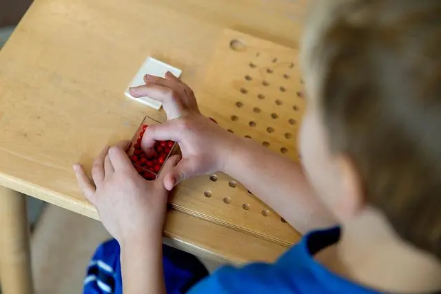 Montessori student playing